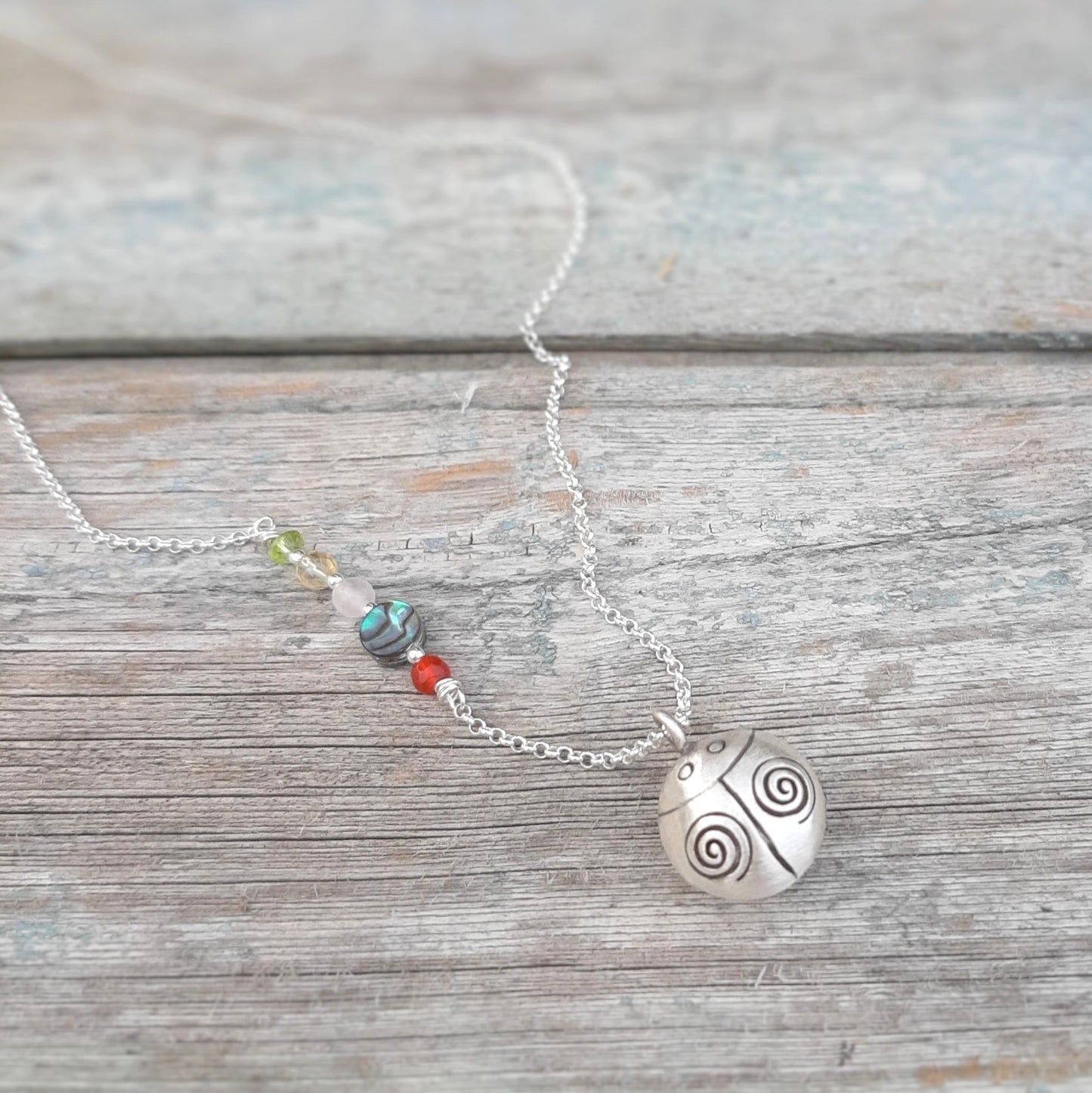 Pendentif coccinelle argent symbole de chance et de protection