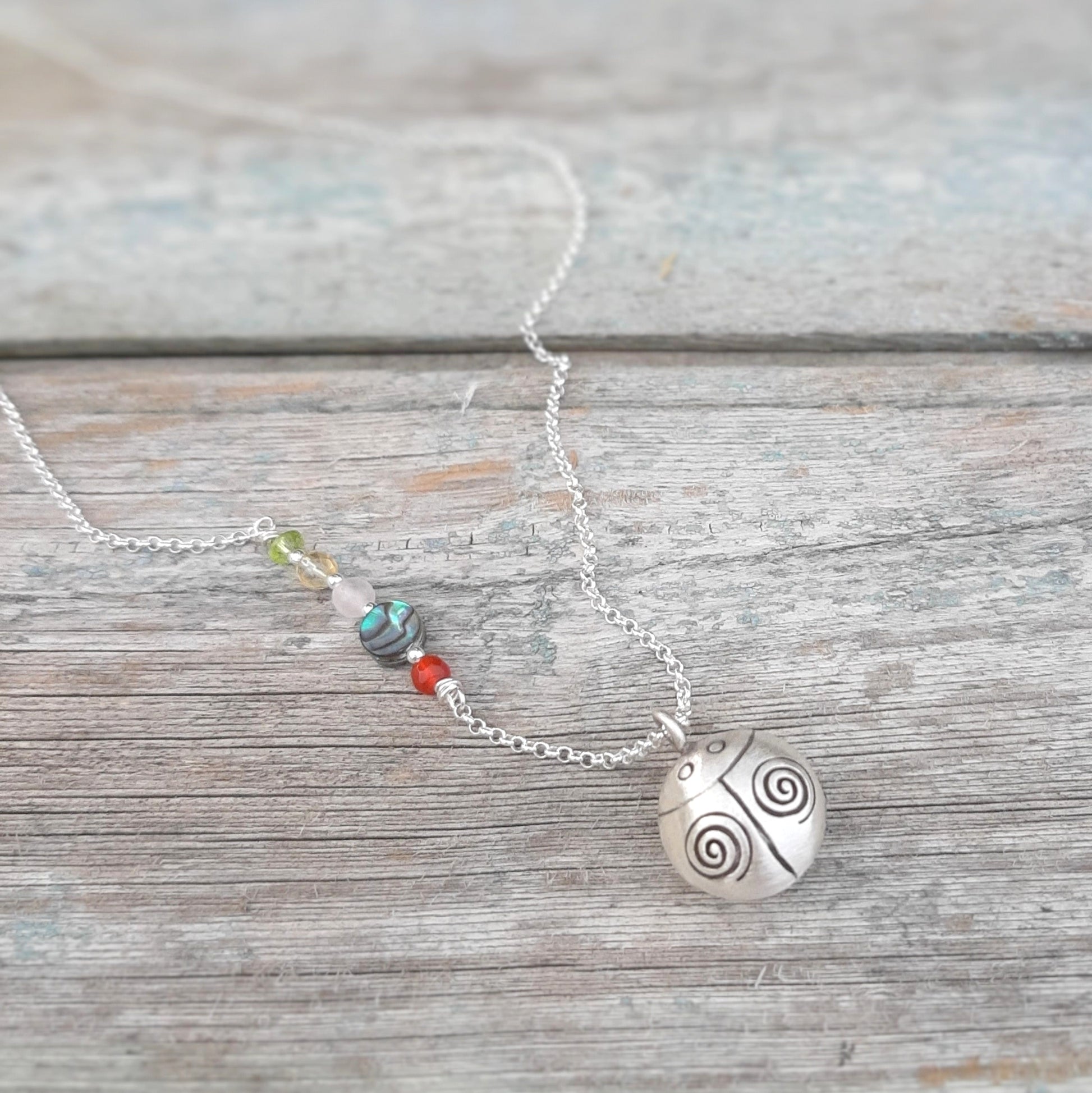 Pendentif coccinelle argent symbole de chance et de protection