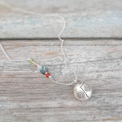 Pendentif coccinelle argent symbole de chance et de protection